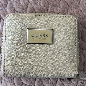 Selling Preloved Wallet / Guess / White in glittery color / Silver hardware /